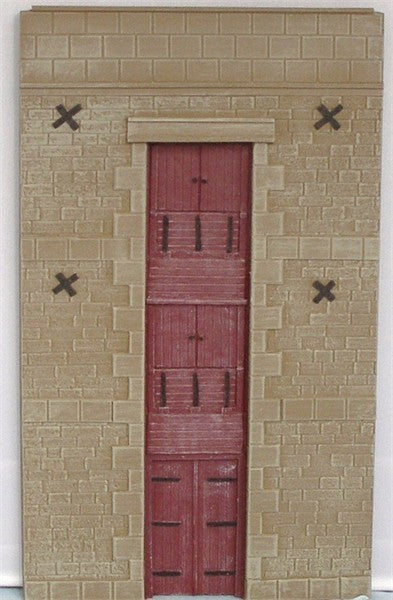 3-storey stone mill/warehouse building facade with warehouse doors to each floor UNPAINTED